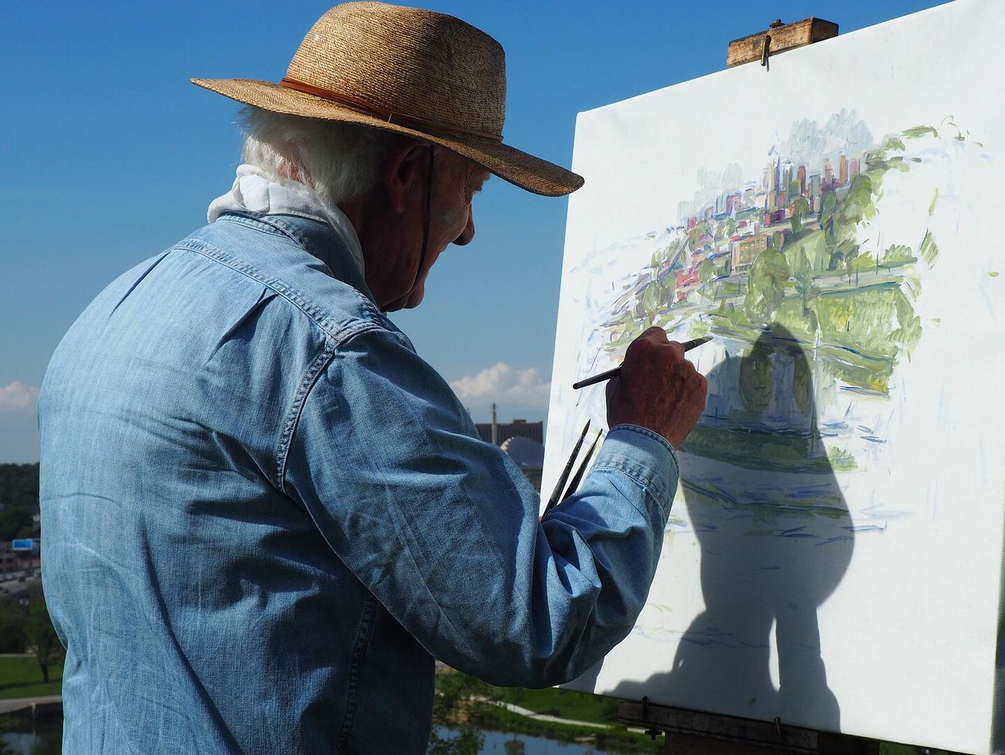 man painting in July Summit Park County